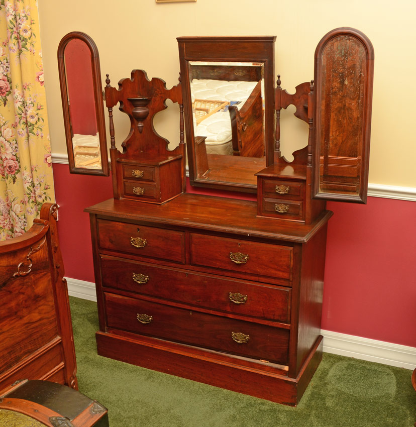 Appraisal: WALNUT GULL WING DRESSER Central beveled mirror with glove box