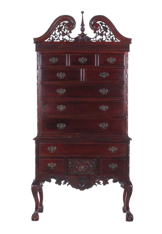 Appraisal: Chippendale style mahogany chest-on-stand swan's-neck pierce-carved pediment upper case with