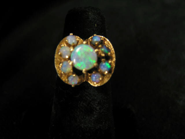 Appraisal: Opal Ring nine rich blue-green gems in k yellow gold