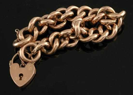 Appraisal: A gold padlock bracelet The hollow curblinks individually stamped ct