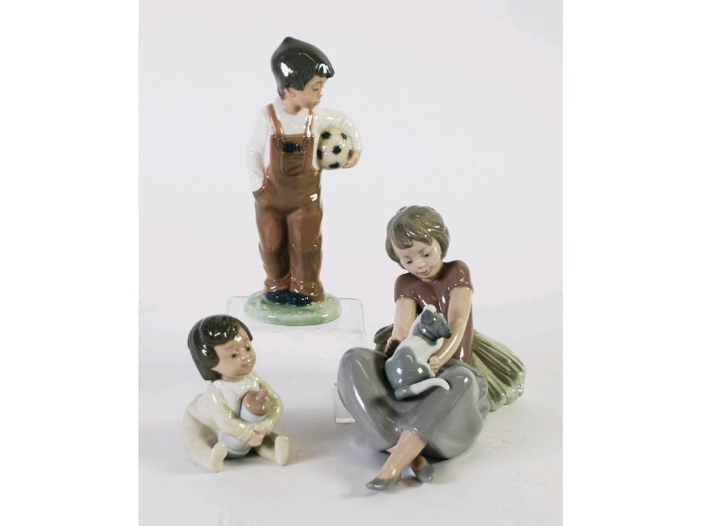 Appraisal: THREE NAO SPANISH PORCELAIN FIGURE OF CHILDREN comprising one modelled