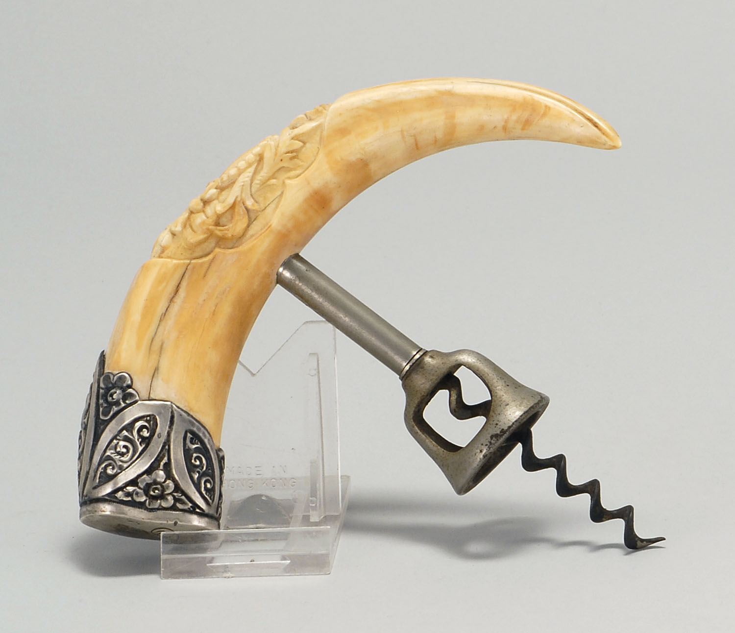 Appraisal: CORKSCREW th CenturyBoar's tusk handle with relief-carved foliate designs and