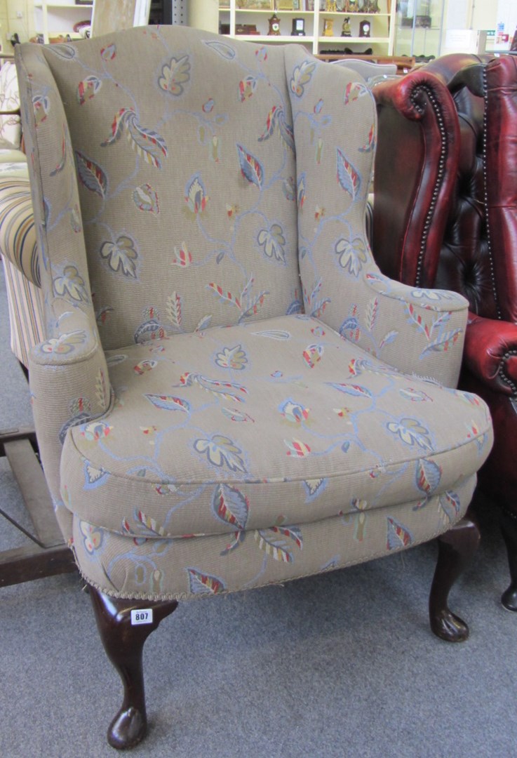 Appraisal: A mid th century design wingback armchair with bow seat