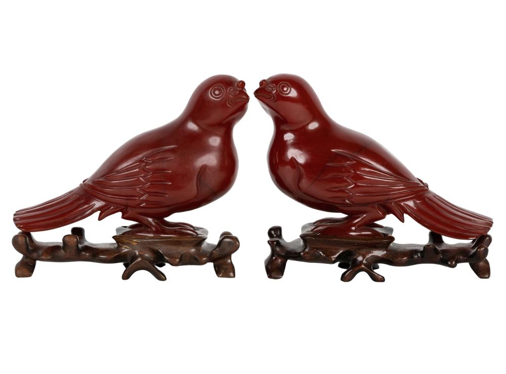 Appraisal: PAIR OF CHINESE CARVED AMBER BUFFALO HORN BIRD FIGURES th