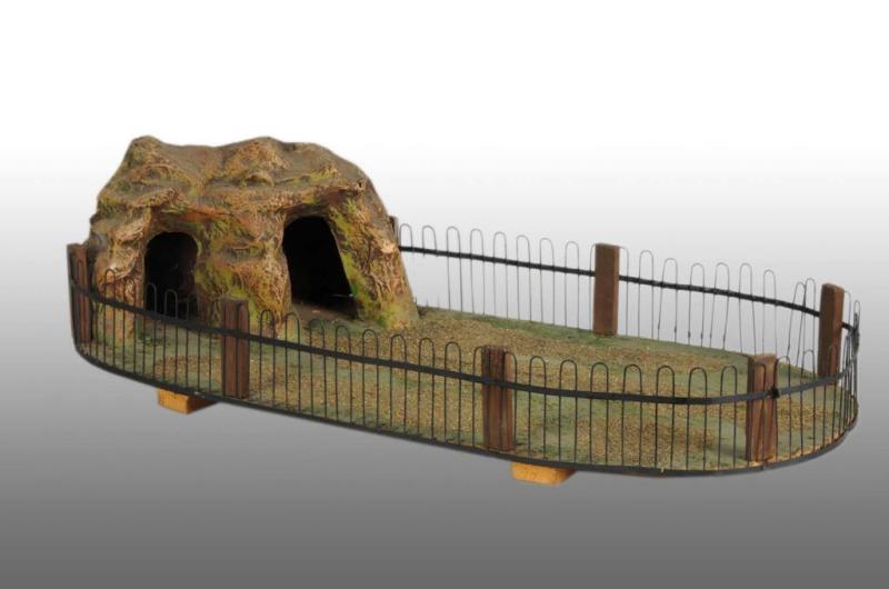 Appraisal: Elastolin Lineol Rock Cave Scene with Metal Fence Description Circa