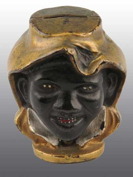 Appraisal: Cast Iron -Face Black Boy Still Bank Description Manufactured by