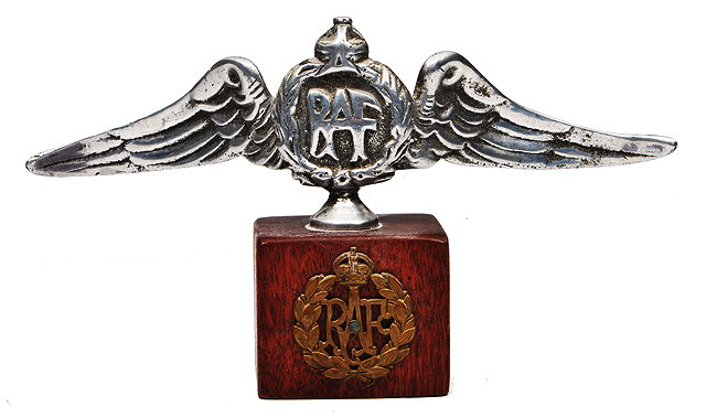 Appraisal: AN ALUMINIUM RAF WINGED CAR MASCOT on later wooden base