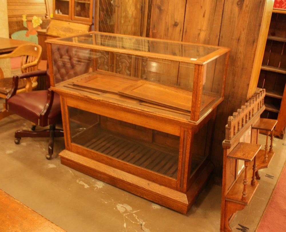 Appraisal: AN ANTIQUE OAK AND GLASS TWO-LEVEL SHOWCASE American c H