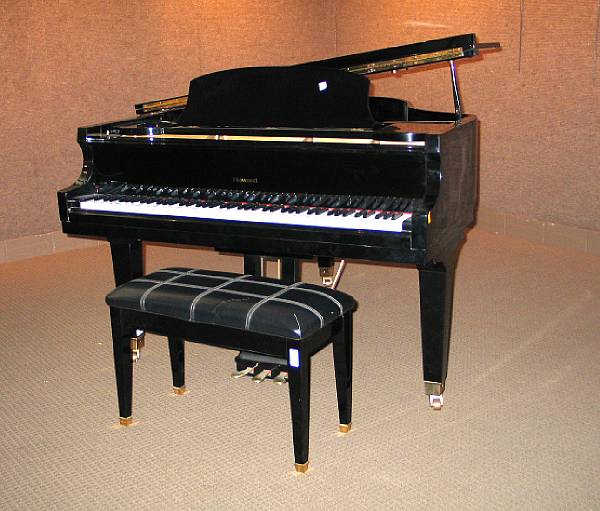 Appraisal: A Howard ebonized piano manufactured by the Baldwin Piano Co