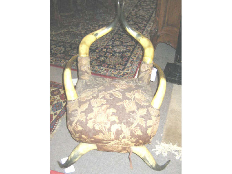 Appraisal: ANTIQUE NATURAL ANIMAL HORN CHAIR Large two horn back two