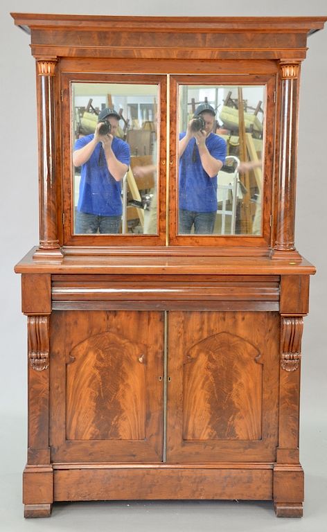 Appraisal: Empire mahogany cabinet with two mirrored doors over one long