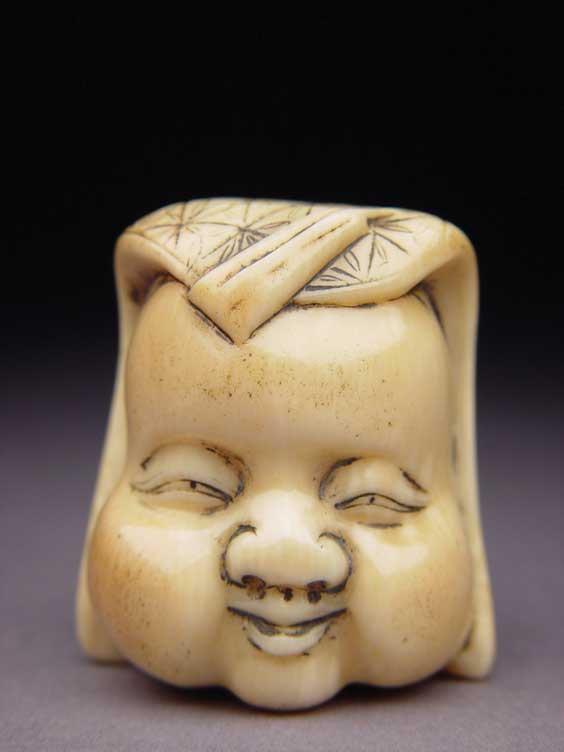 Appraisal: ANTIQUE IVORY NETSUKE Well carved and polished antique ivory netsuke