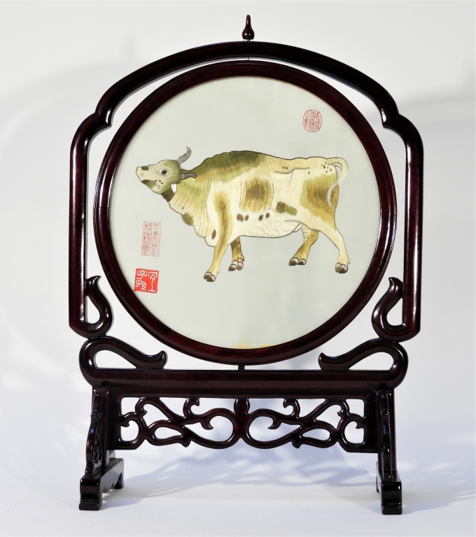 Appraisal: CHINESE SILK OX EMBROIDERED TABLE SCREEN China th CenturyStylized embroidered