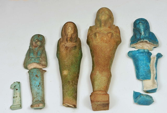 Appraisal: AN EGYPTIAN CELADON GLAZED SHABTI OR FUNERARY FIGURE cm high