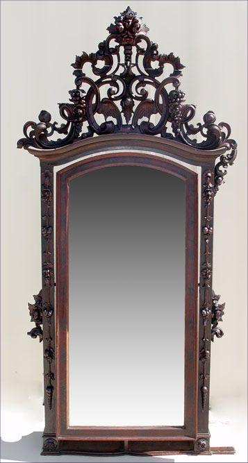 Appraisal: RICHLY CARVED ROSEWOOD AND MAHOGANY CHEVAL MIRROR Full length beveled