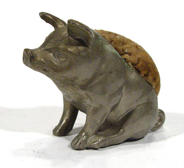 Appraisal: Cast metal seated pig pin cushion cm high