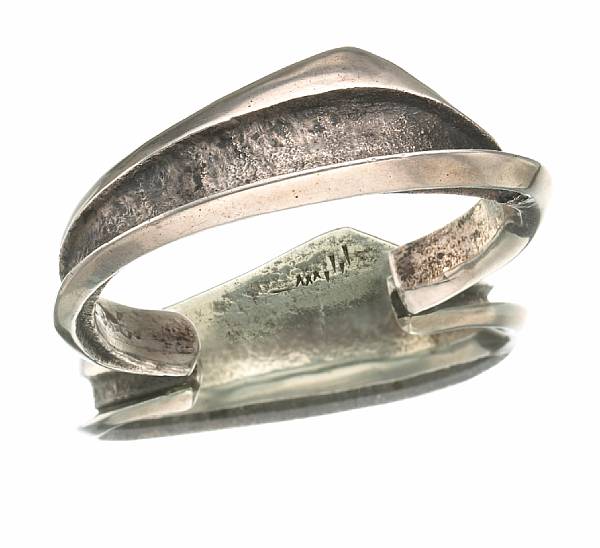 Appraisal: A Hopi bracelet Charles Loloma a silver band with textured