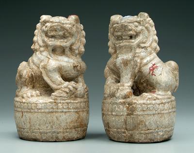 Appraisal: Pair carved stone lions male and female figures wax export