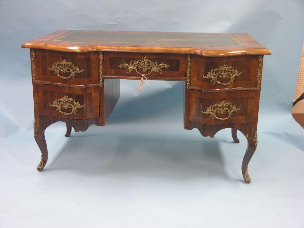 Appraisal: A Louis XV-style walnut bureau-plat inset gilt-tooled leather top above