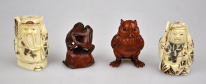 Appraisal: Two Chinese carved ivory chessmen cm to w two netsuke