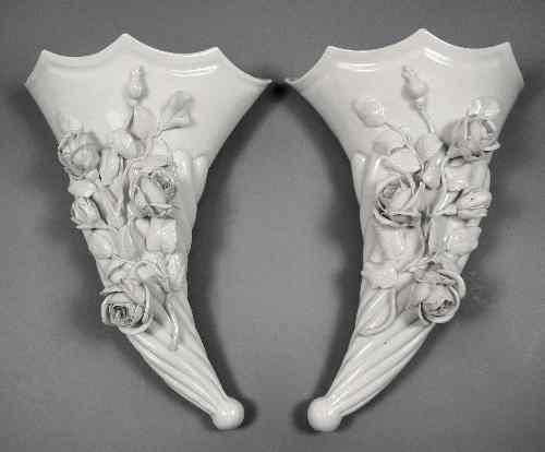 Appraisal: A pair of th Century white glazed porcelain wall pockets