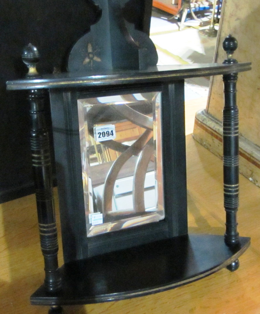 Appraisal: A th century ebonised corner wall shelf a mahogany lift