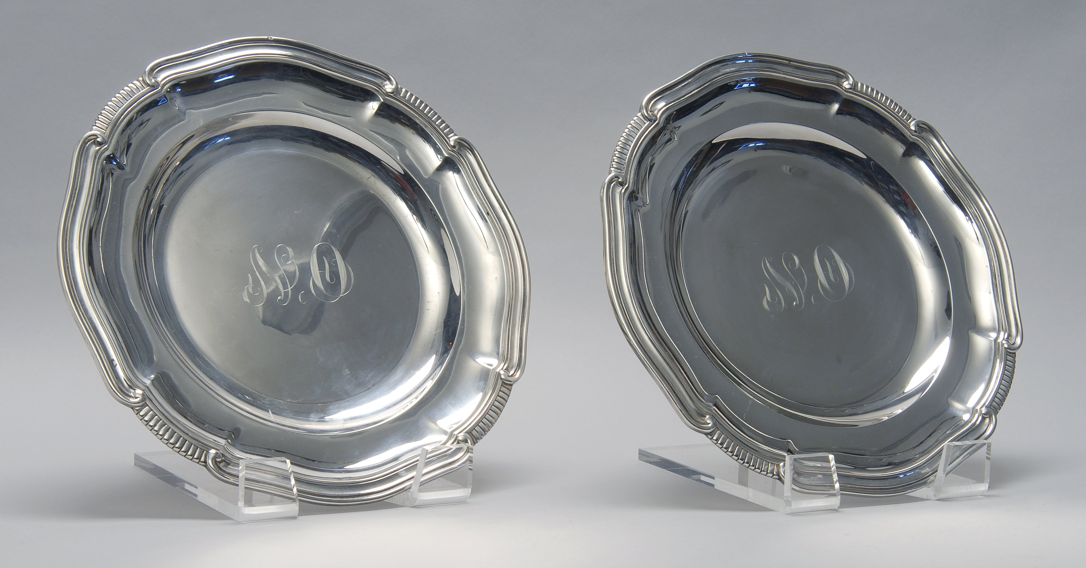 Appraisal: PAIR OF FRENCH FIRST STANDARD SILVER CHARGERS With scalloped edge