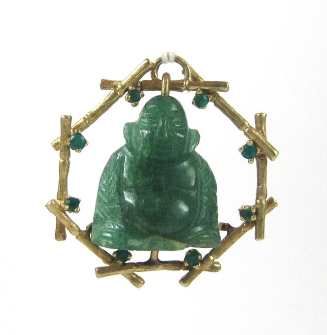 Appraisal: JADE EMERALD AND FOURTEEN KARAT GOLD PENDANT having a yellow