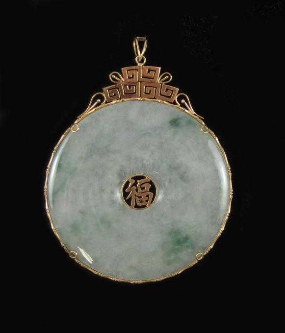 Appraisal: CHINESE JADEITE AND FOURTEEN KARAT GOLD PENDANT The large pendant