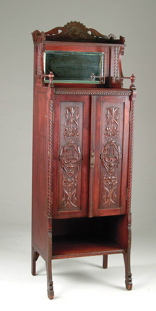 Appraisal: VERY ELABORATE VICTORIAN MUSIC CABINET This tall and ornate Eastlake