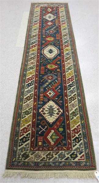 Appraisal: TURKISH CAUCASIAN RUNNER overall geometric design on blue ground hand