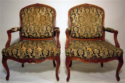 Appraisal: Pair Louis XV style carved walnut fauteils The crested top