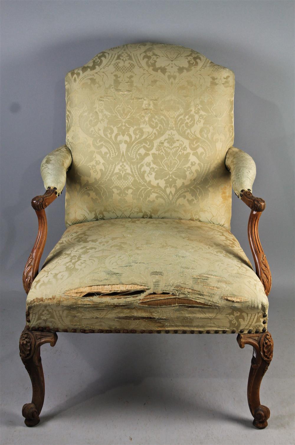 Appraisal: GEORGE III STYLE CARVED WOOD OPEN ARM CHAIR having an