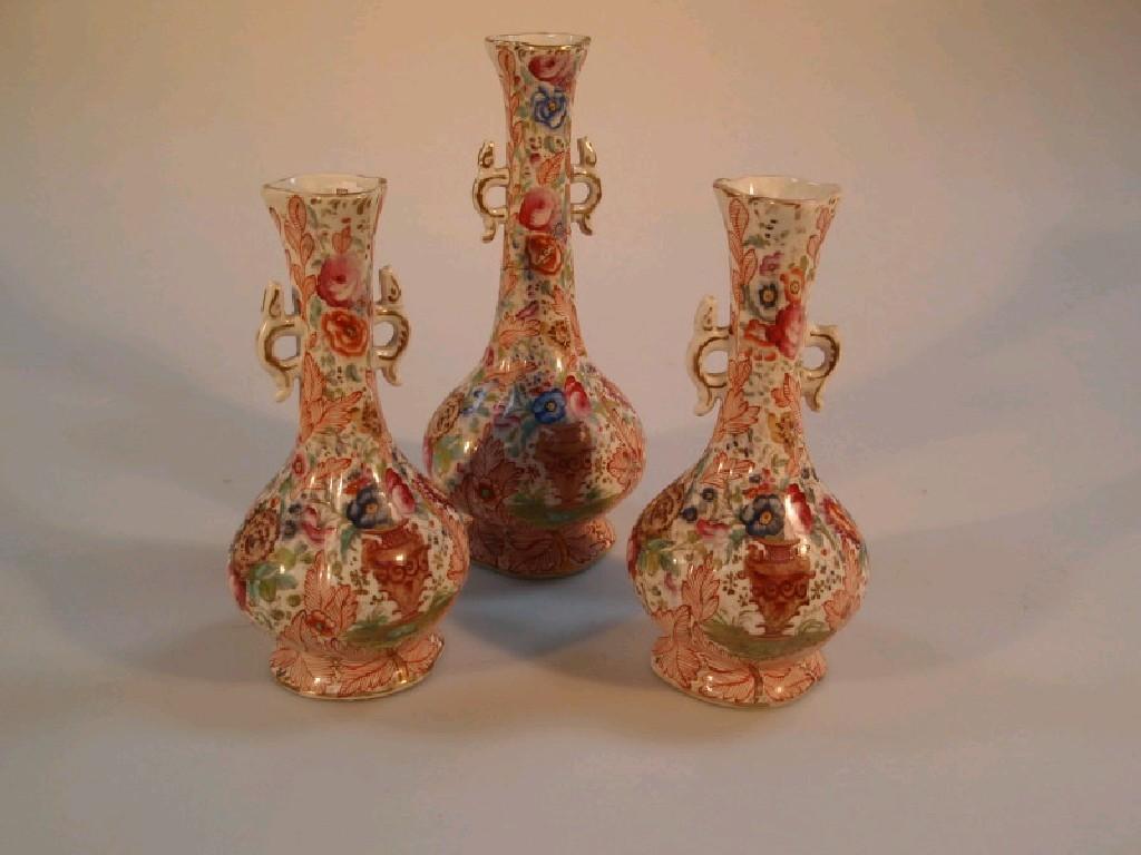 Appraisal: A garniture of three thC English pottery vases having 'Clobberware'