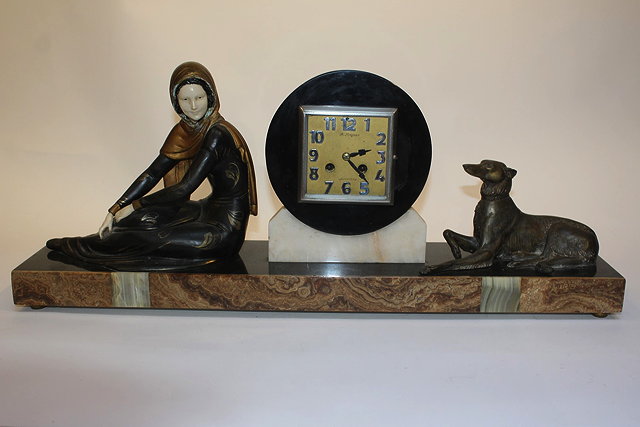 Appraisal: A FRENCH ART DECO SLATE MARBLE AND SPELTER MOUNTED MANTEL