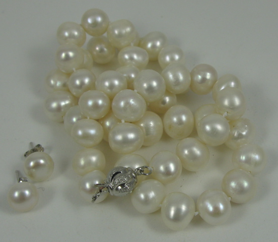 Appraisal: THREE ARTICLES OF PEARL AND WHITE GOLD JEWELRY including a