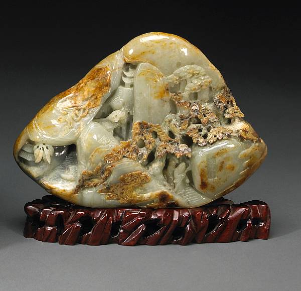 Appraisal: A mottled jade landscape boulder th Century Of triangular shape