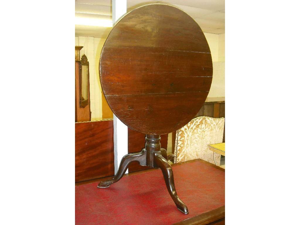 Appraisal: Georgian oak circular tilt-top tripod occasional table with a baluster