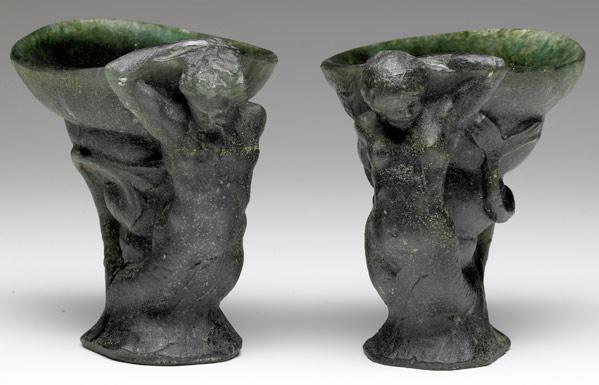 Appraisal: GEORGES DESPRET Pair of dark green pate-de-verre mermaid and merman