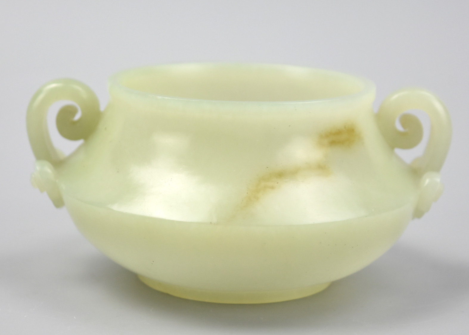 Appraisal: CHINESE PALE GREEN JADE CENSER W RUYI HANDLES A Chinese