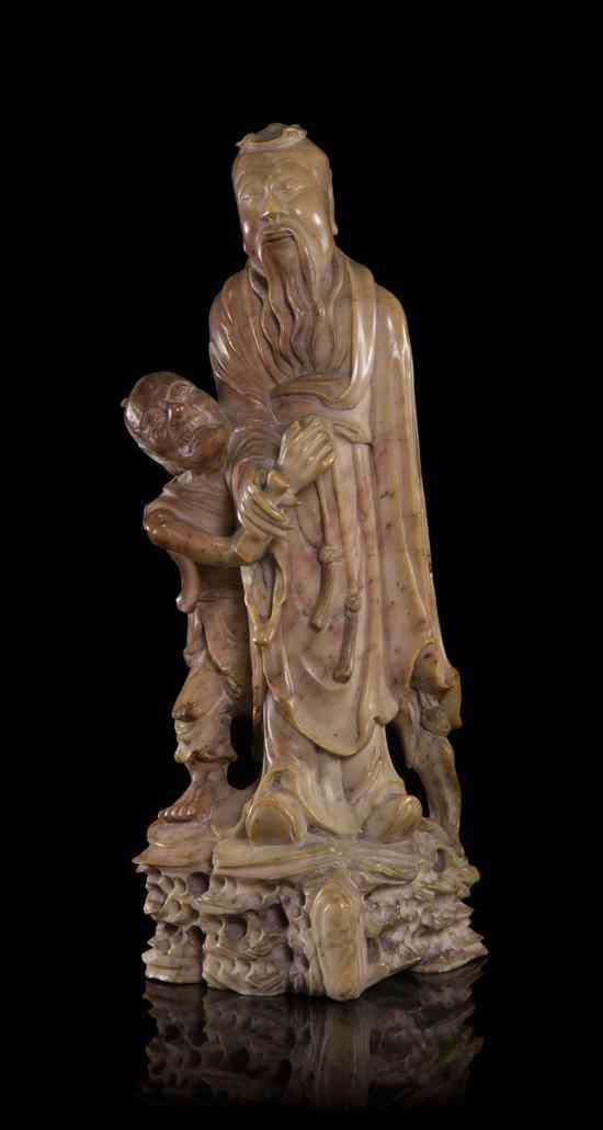 Appraisal: A Chinese Steatite Carving depicting two figures having flowing robes