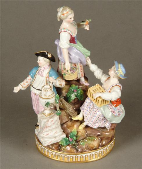 Appraisal: A Meissen group of children modelled upon rockwork cm high