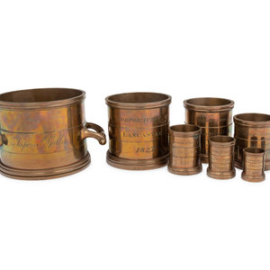 Appraisal: A Set of Eight English Brass Graduated Imperial Bushel Measures