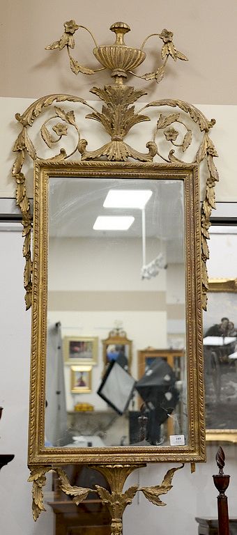 Appraisal: Italian Neoclassical style giltwood mirror rectangular surmounted by a scrolled