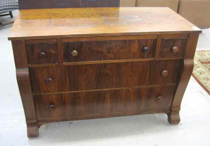 Appraisal: EMPIRE REVIVAL WALNUT DRESSER American c having three aligned drawers