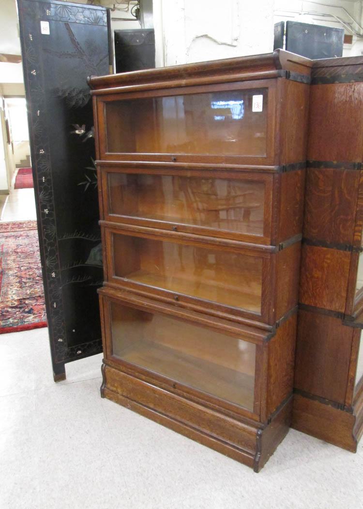 Appraisal: STACKING OAK BOOKCASE American early th century having four stacking