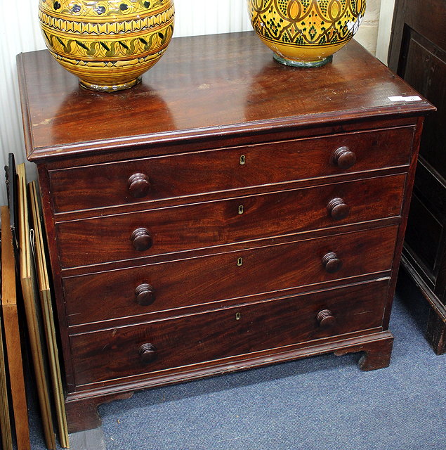 Appraisal: A TH CENTURY MAHOGANY CHEST OF FOUR LONG GRADUATED DRAWERS