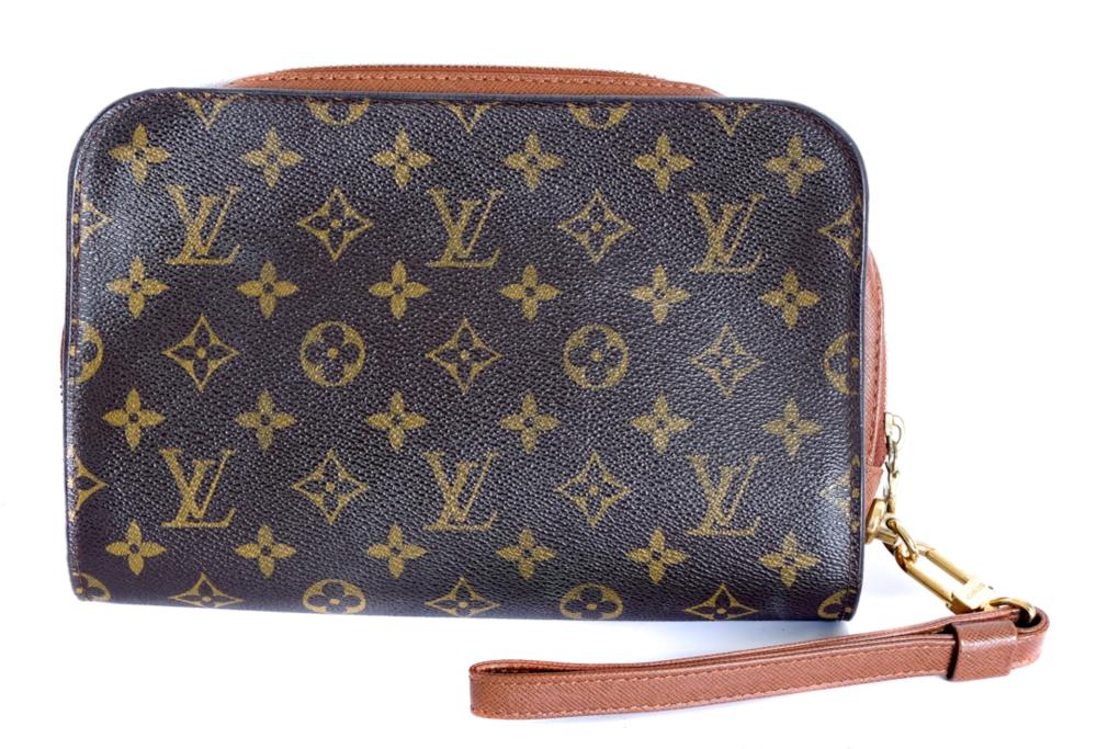 Appraisal: LOUIS VUITTON MONOGRAMMED CANVAS WRISTLETLouis Vuitton monogrammed canvas wristlet with