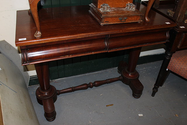 Appraisal: A VICTORIAN MAHOGANY SIDE TABLE with two frieze drawers and