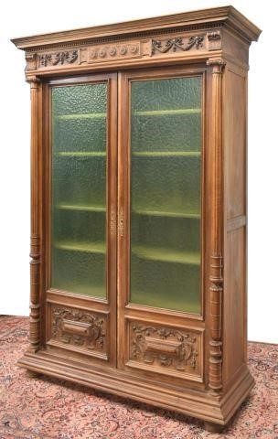 Appraisal: French carved walnut bookcase th c having crown molding over